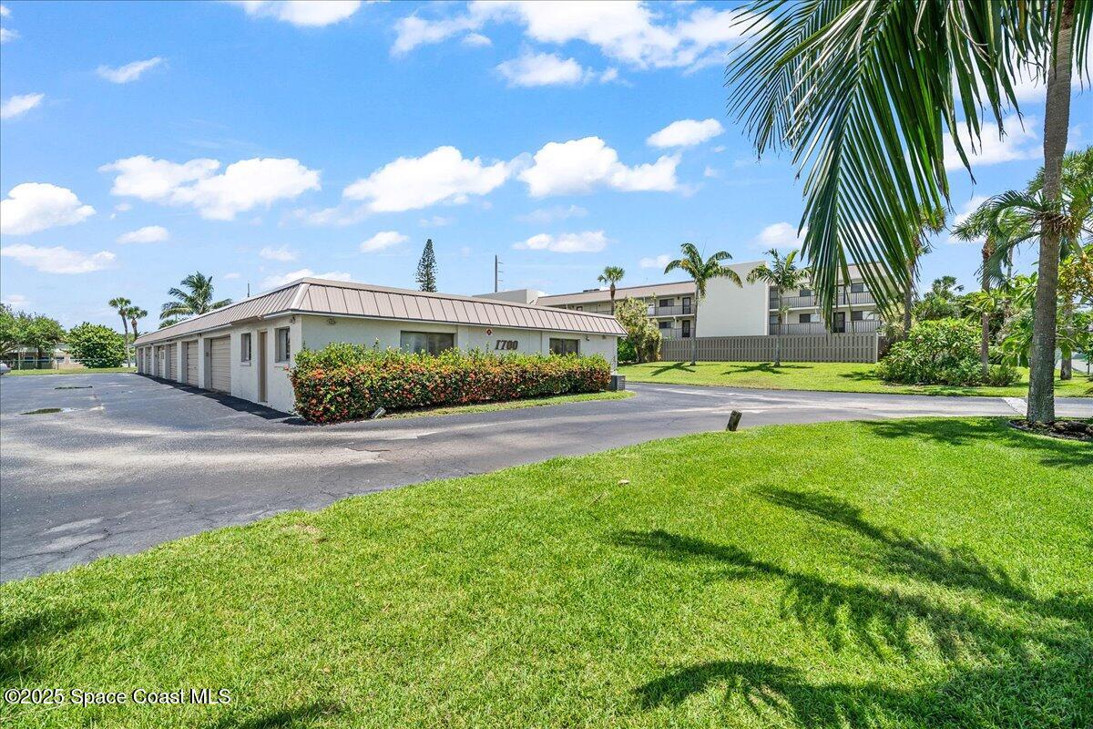 1700 South Atlantic Avenue, Unit 104 Cocoa Beach, FL 32931 - Photo 26 of 55 a view of a garden