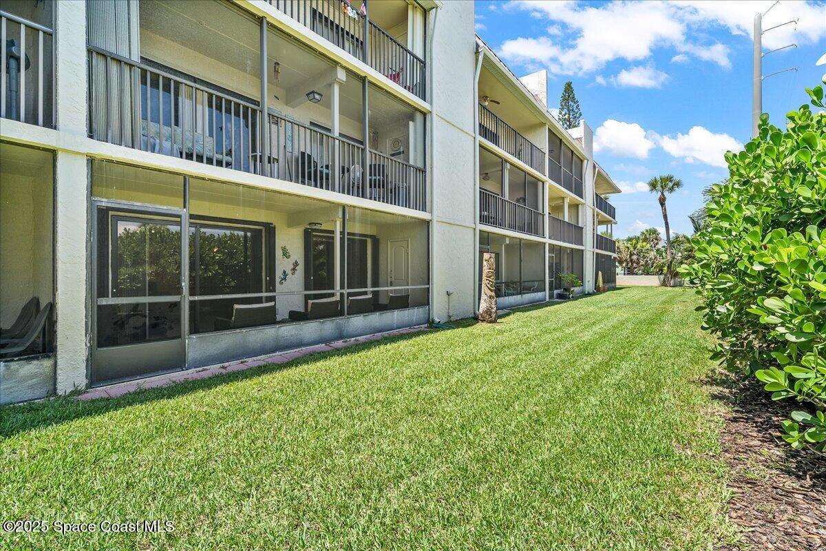 1700 South Atlantic Avenue, Unit 104 Cocoa Beach, FL 32931 - Photo 29 of 55 a view of an apartment with a backyard