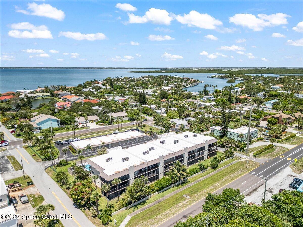 1700 South Atlantic Avenue, Unit 104 Cocoa Beach, FL 32931 - Photo 35 of 55 an aerial view of residential houses with outdoor space