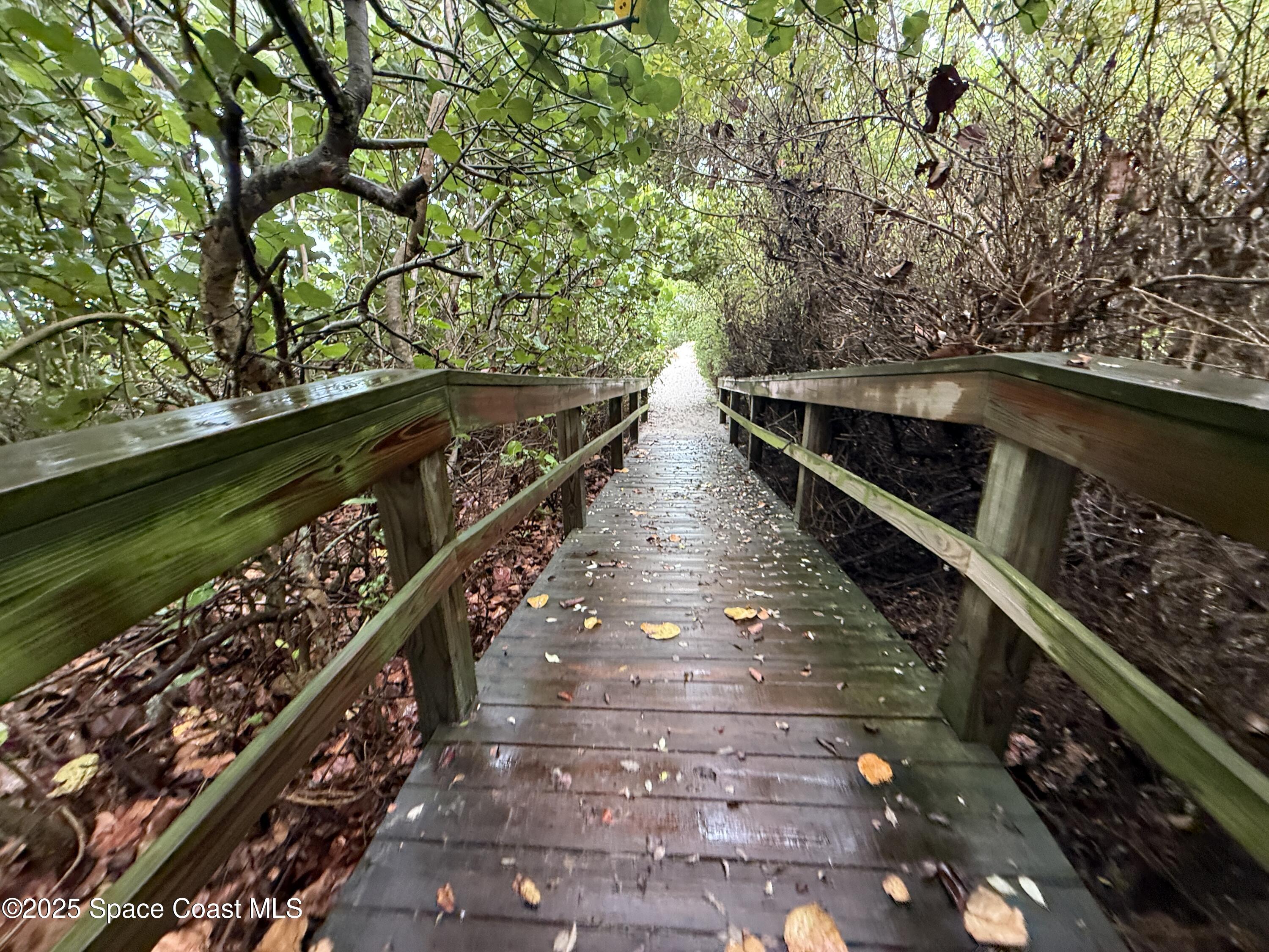1700 South Atlantic Avenue, Unit 104 Cocoa Beach, FL 32931 - Photo 50 of 55 a view of a balcony with wooden floor