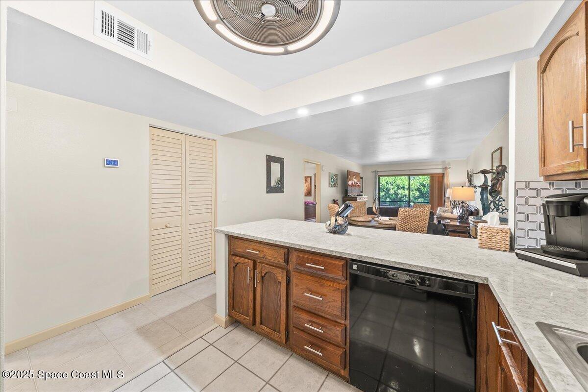 1700 South Atlantic Avenue, Unit 104 Cocoa Beach, FL 32931 - Photo 9 of 55 a kitchen with a sink and a stove