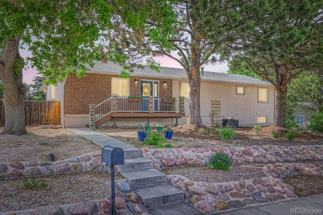 a house that has tree in front of it