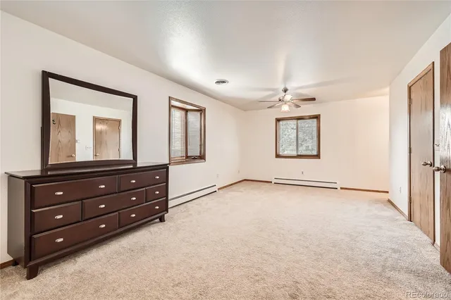 a room with a dresser and a mirror