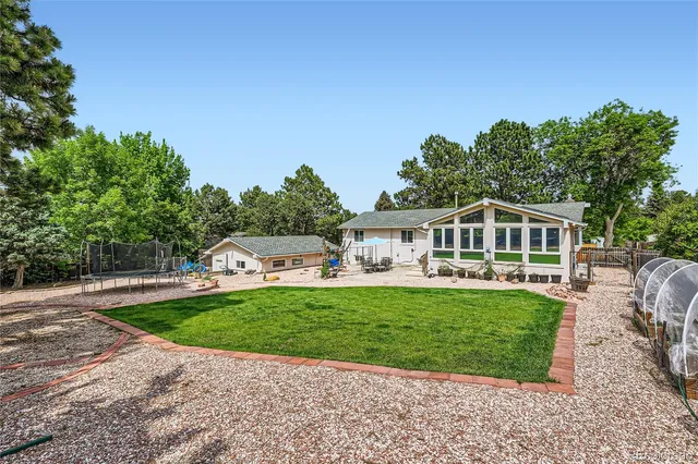 a front view of a house with a garden and porch