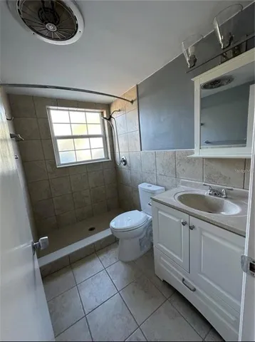 a bathroom with a sink a toilet and vanity