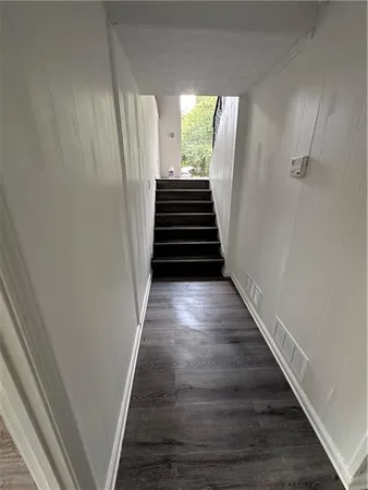 a view of entryway and wooden floor