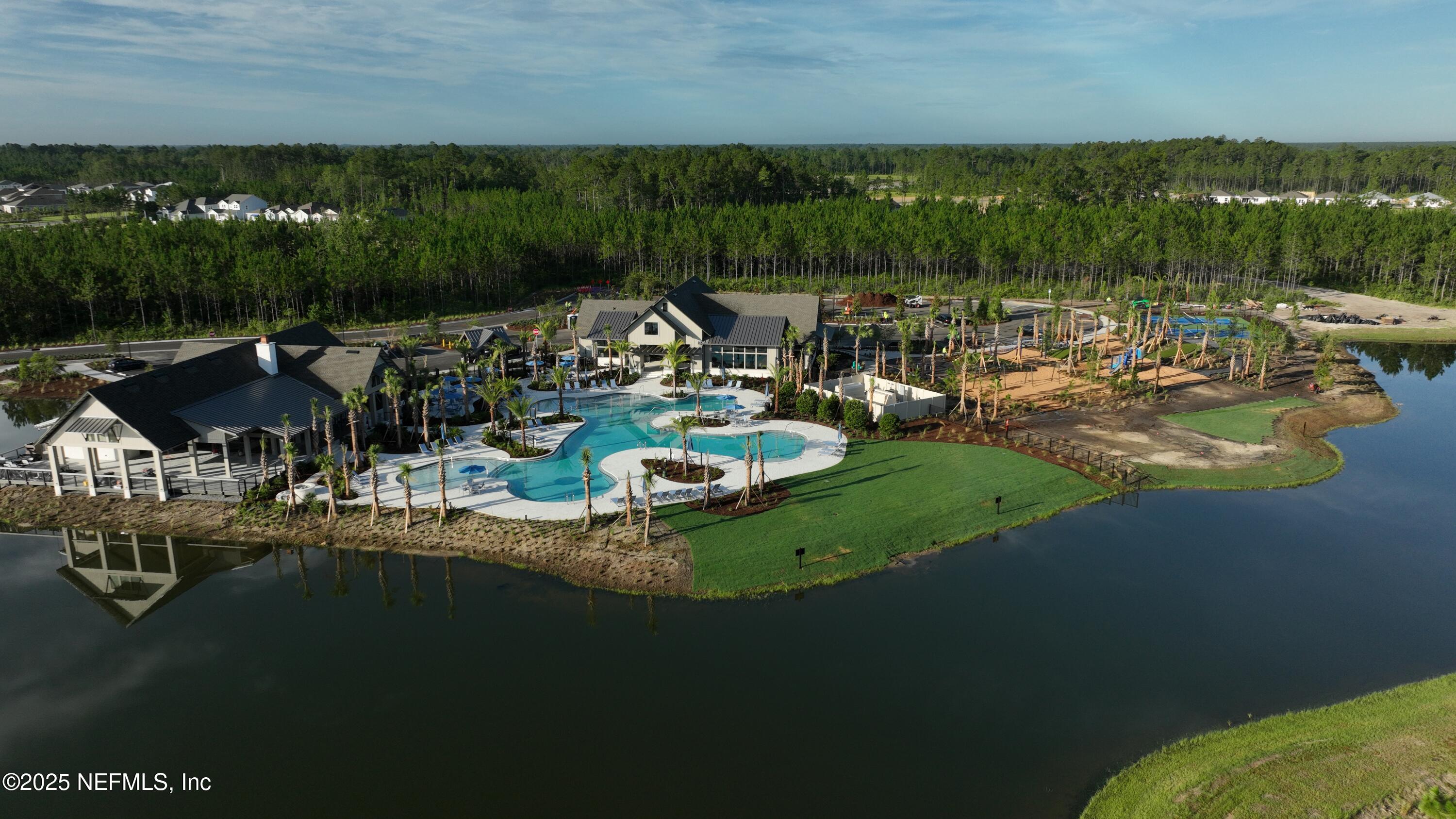 76069 Estuary Way Yulee, FL 32097 - Photo 11 of 42 a view of a lake with houses