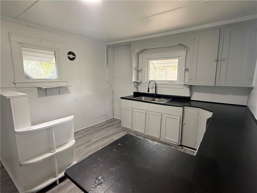 307 Andrew Street Sharon, PA 16146 - Photo 5 of 7 a kitchen with a sink and cabinets