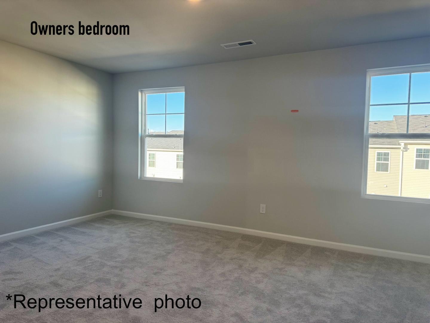 168 Aster Bloom Lane Raleigh, NC 27610 - Photo 19 of 38 an empty room with windows