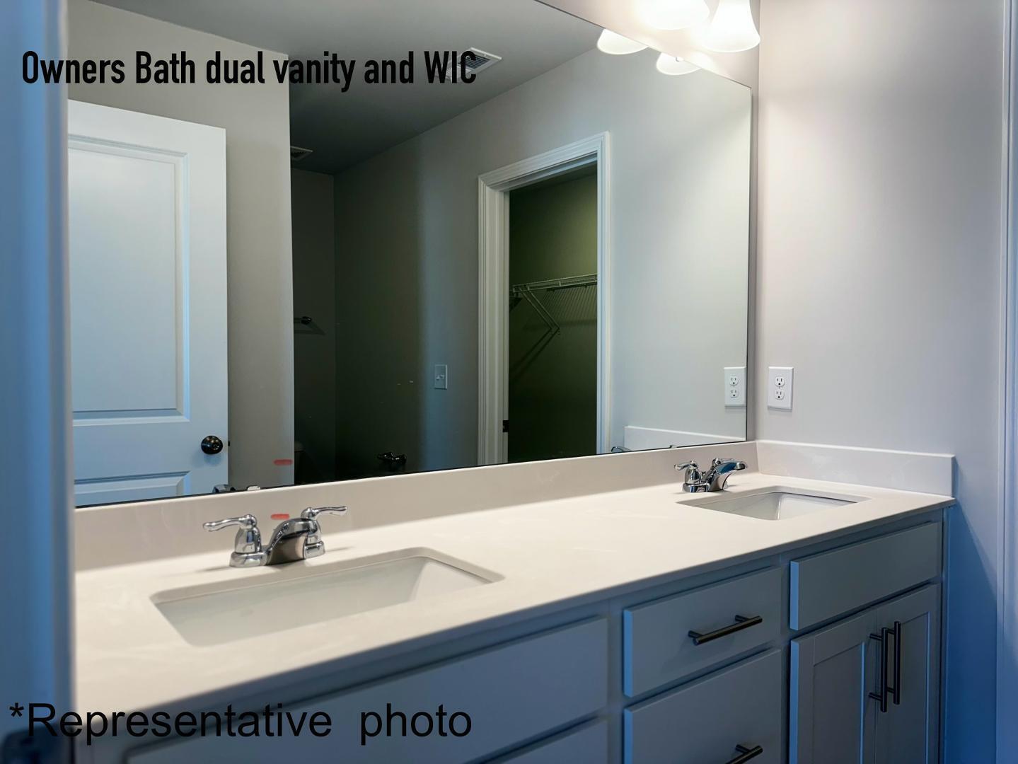 168 Aster Bloom Lane Raleigh, NC 27610 - Photo 20 of 38 a bathroom with a sink and a mirror