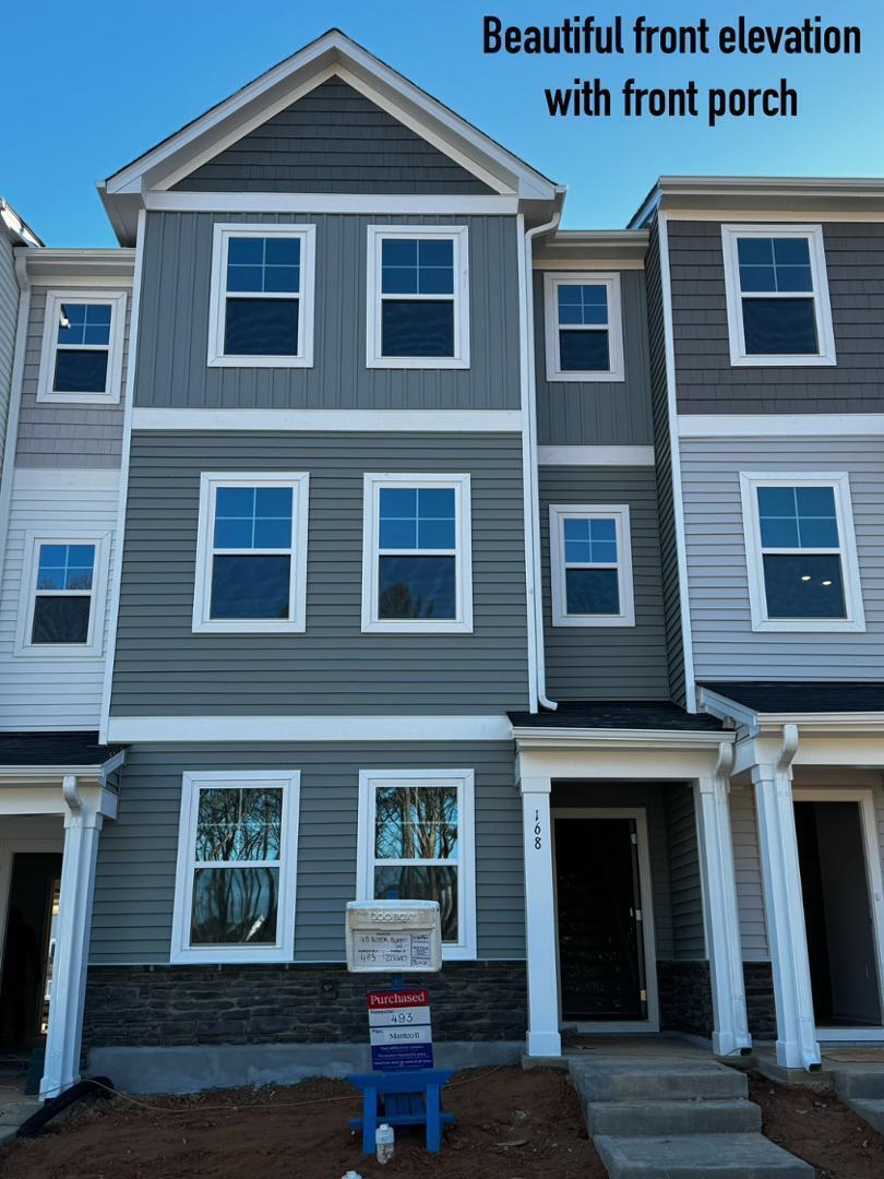 168 Aster Bloom Lane Raleigh, NC 27610 - Photo 2 of 38 a front view of a house with windows