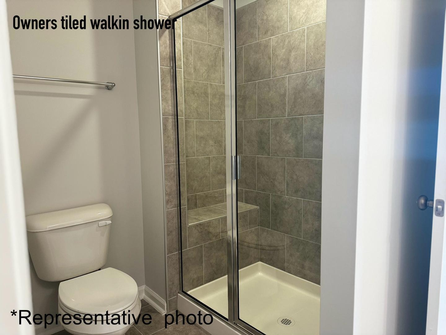 168 Aster Bloom Lane Raleigh, NC 27610 - Photo 21 of 38 a bathroom with a toilet and a shower
