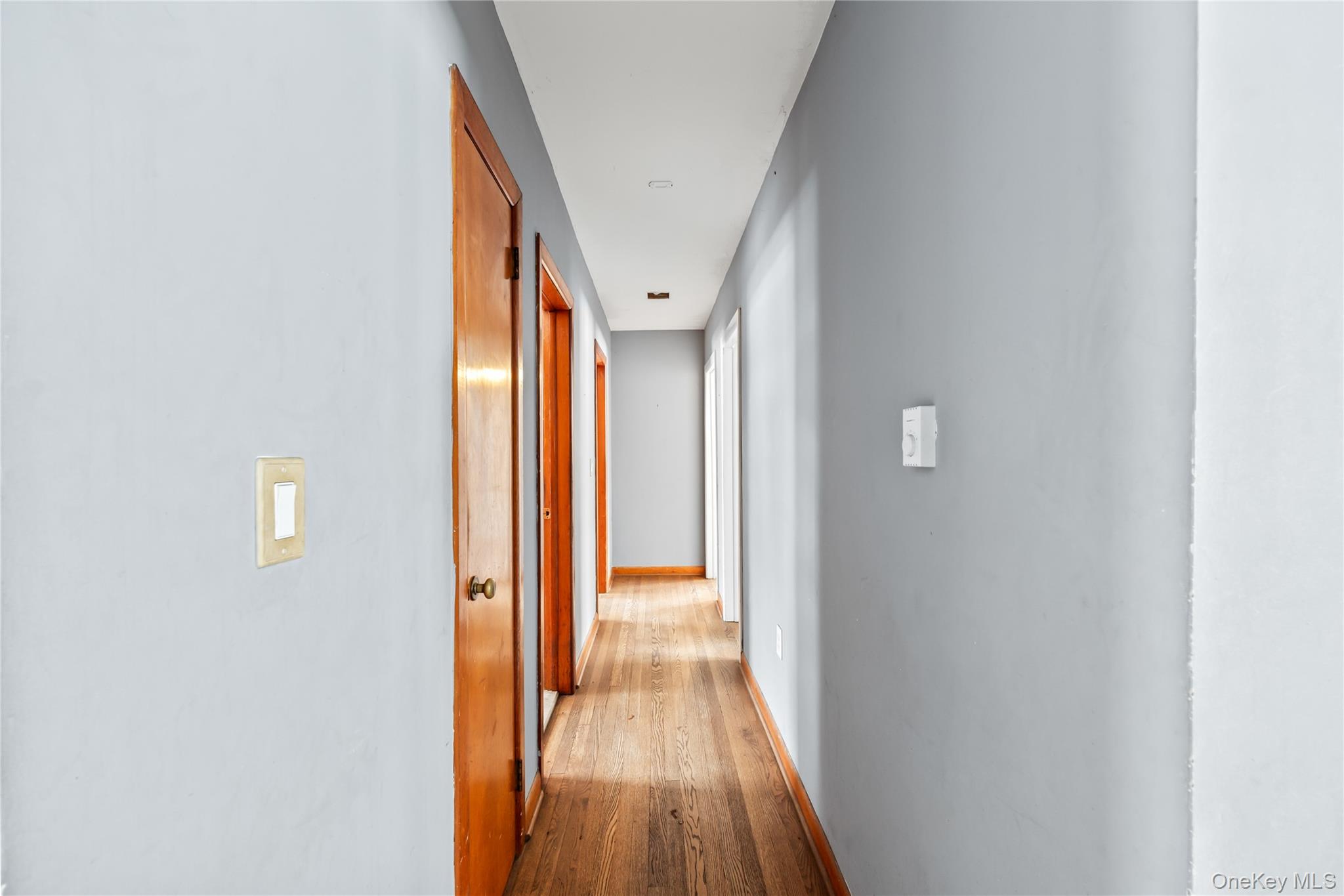 15 Bridge Street Suffern, NY 10901 - Photo 11 of 22 a view of a hallway with wooden floor