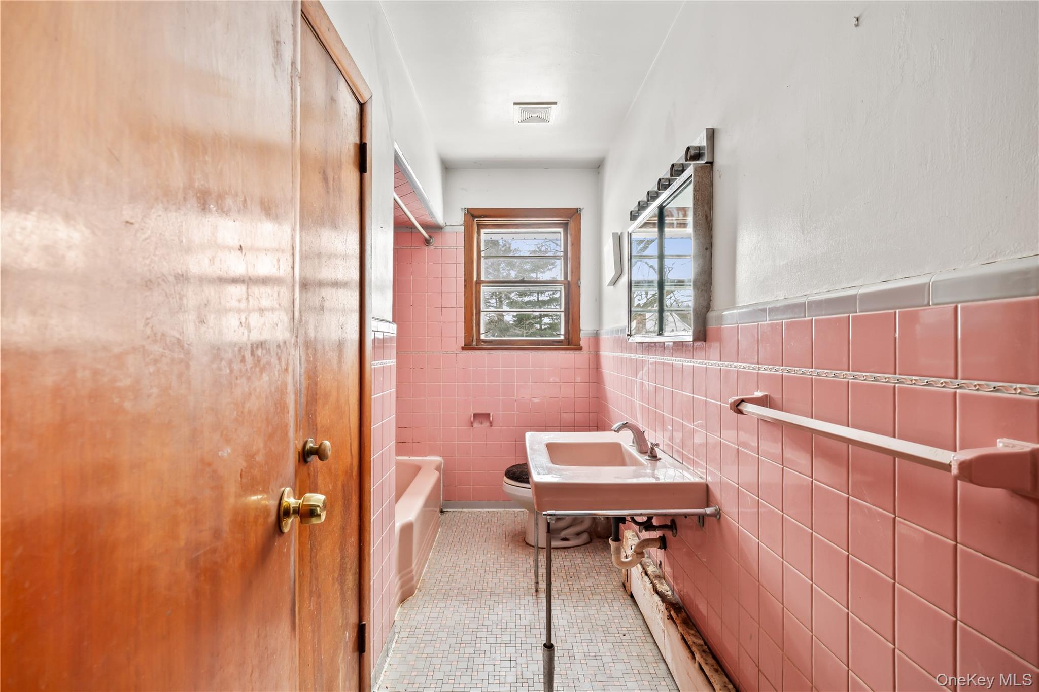 15 Bridge Street Suffern, NY 10901 - Photo 13 of 22 a bathroom with a sink and a mirror