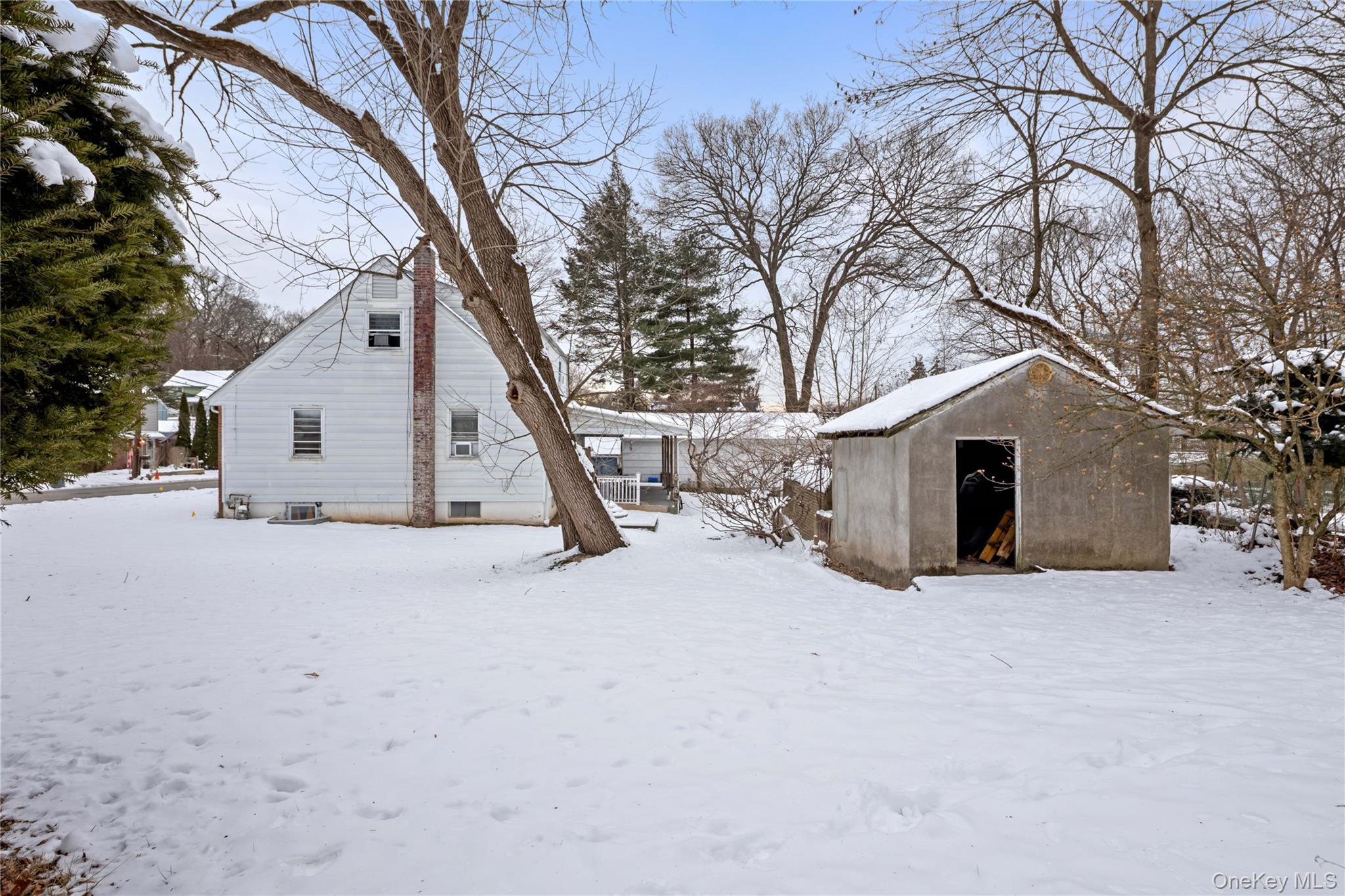 15 Bridge Street Suffern, NY 10901 - Photo 20 of 22 a view of a house with a snow in the yard