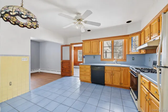 a view of white house with a snow on the wall