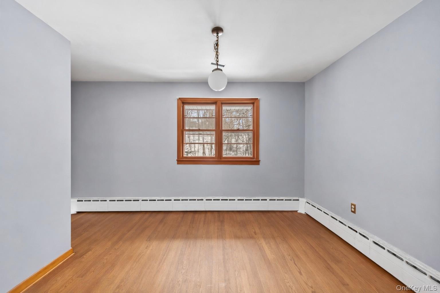 15 Bridge Street Suffern, NY 10901 - Photo 10 of 22 a view of a room with wooden floor and windows