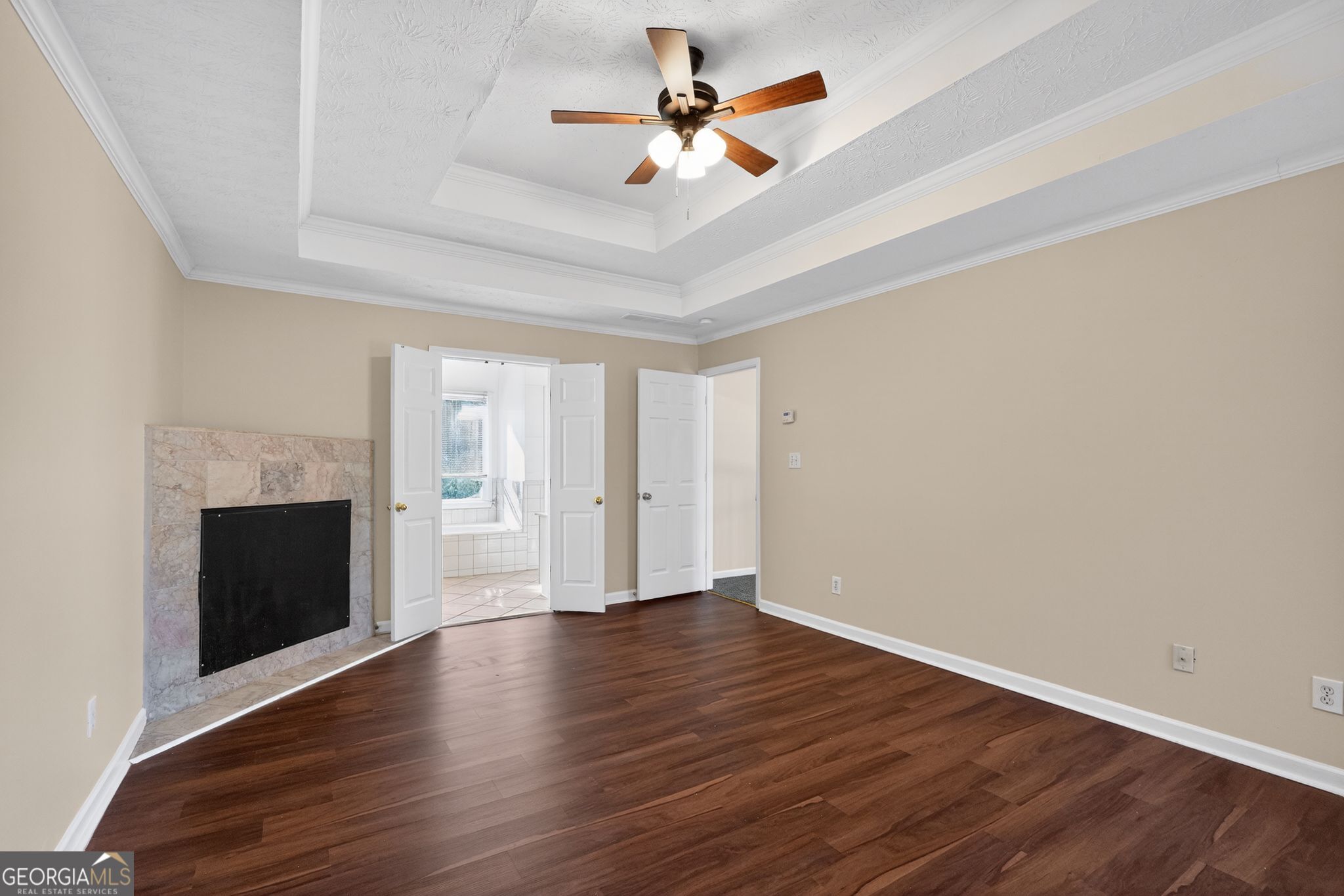 3960 East Saddle Ridge Drive Lithonia, GA 30038 - Photo 12 of 36 wooden floor in an empty room with a fireplace