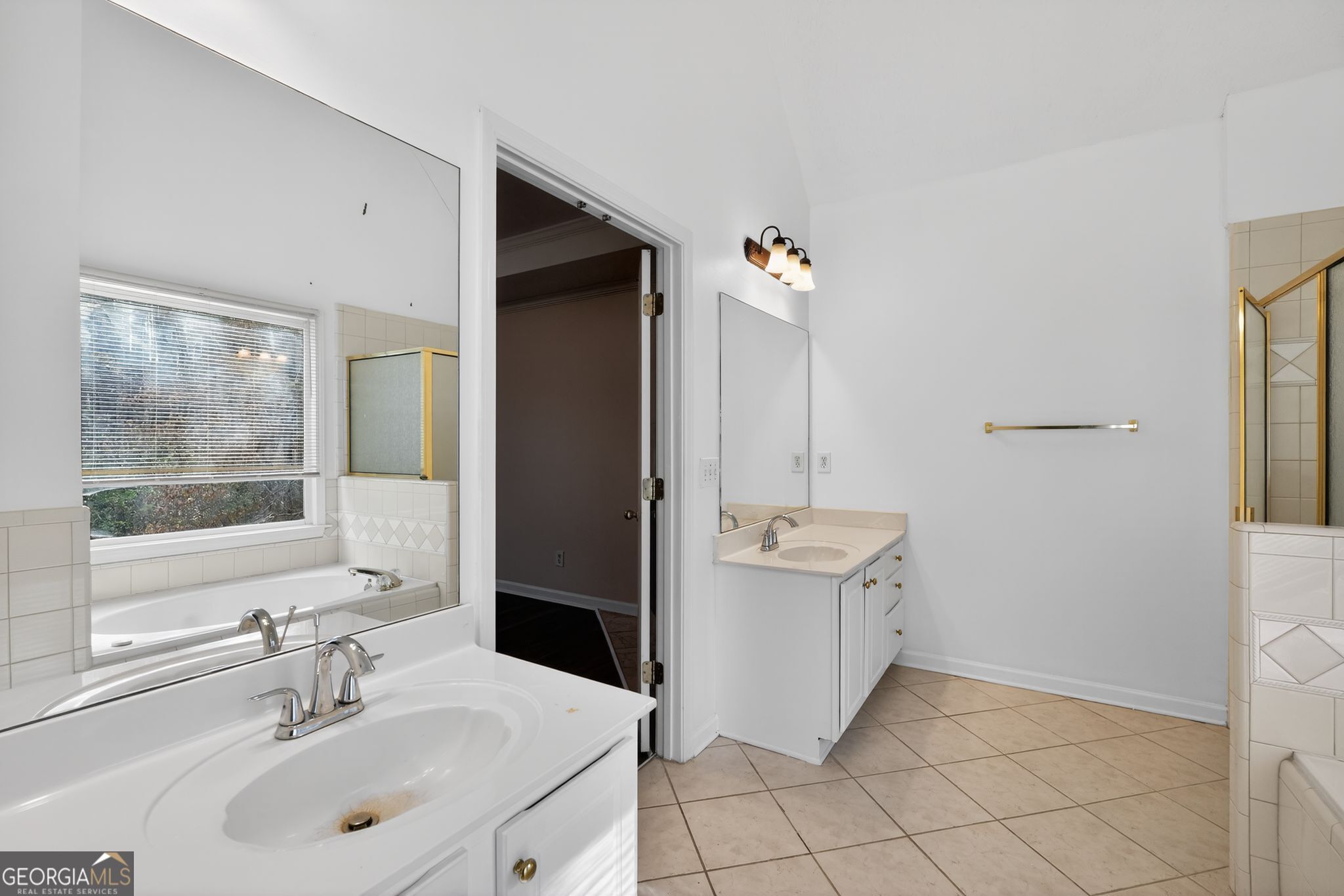 3960 East Saddle Ridge Drive Lithonia, GA 30038 - Photo 19 of 36 a bathroom with a sink toilet and shower