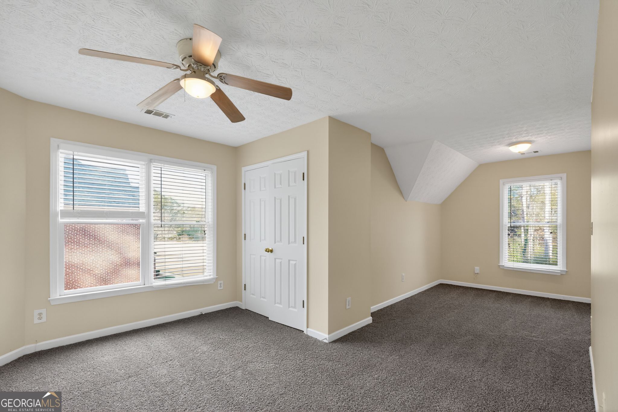 3960 East Saddle Ridge Drive Lithonia, GA 30038 - Photo 25 of 36 a view of an empty room with a window