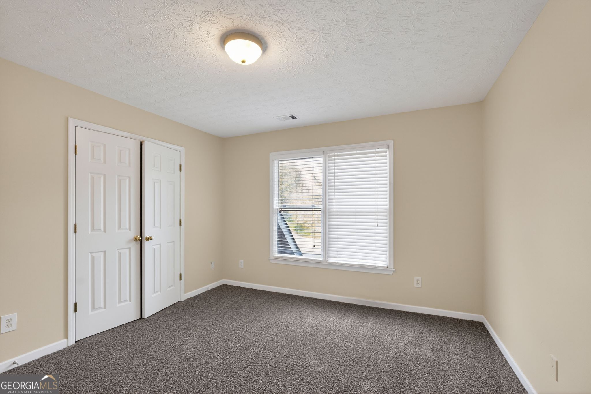 3960 East Saddle Ridge Drive Lithonia, GA 30038 - Photo 31 of 36 an empty room with windows