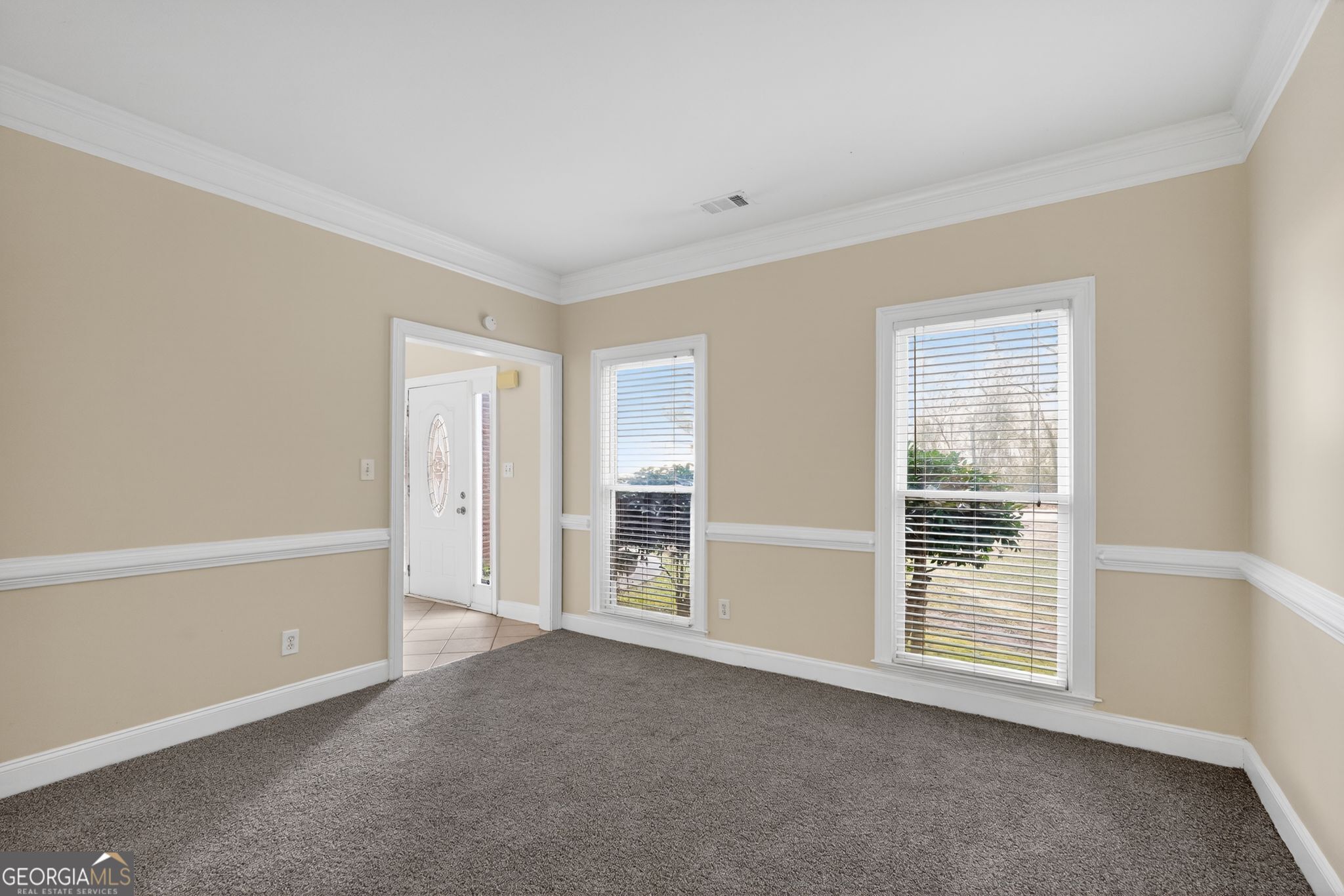 3960 East Saddle Ridge Drive Lithonia, GA 30038 - Photo 5 of 36 a view of an empty room with a window