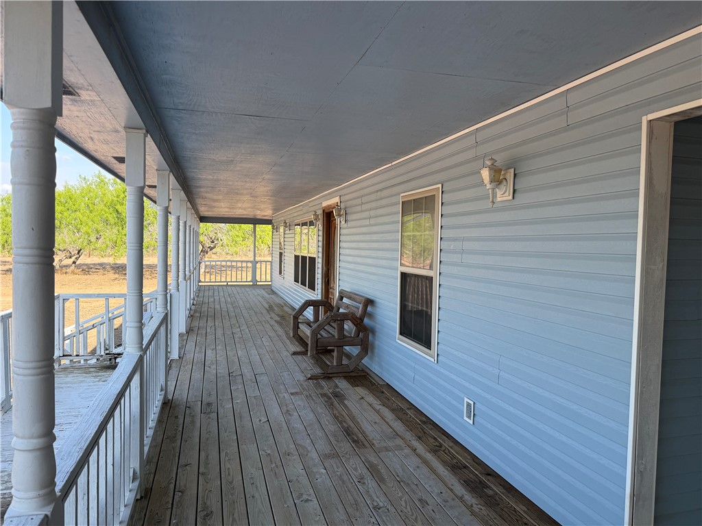 4493 Highway 359 Benavides, TX 78341 - Photo 12 of 20 a balcony with wooden floor