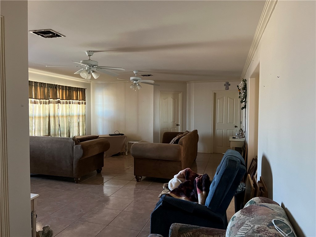 4493 Highway 359 Benavides, TX 78341 - Photo 6 of 20 a living room with furniture and a window