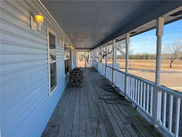 a view of balcony with wooden floor