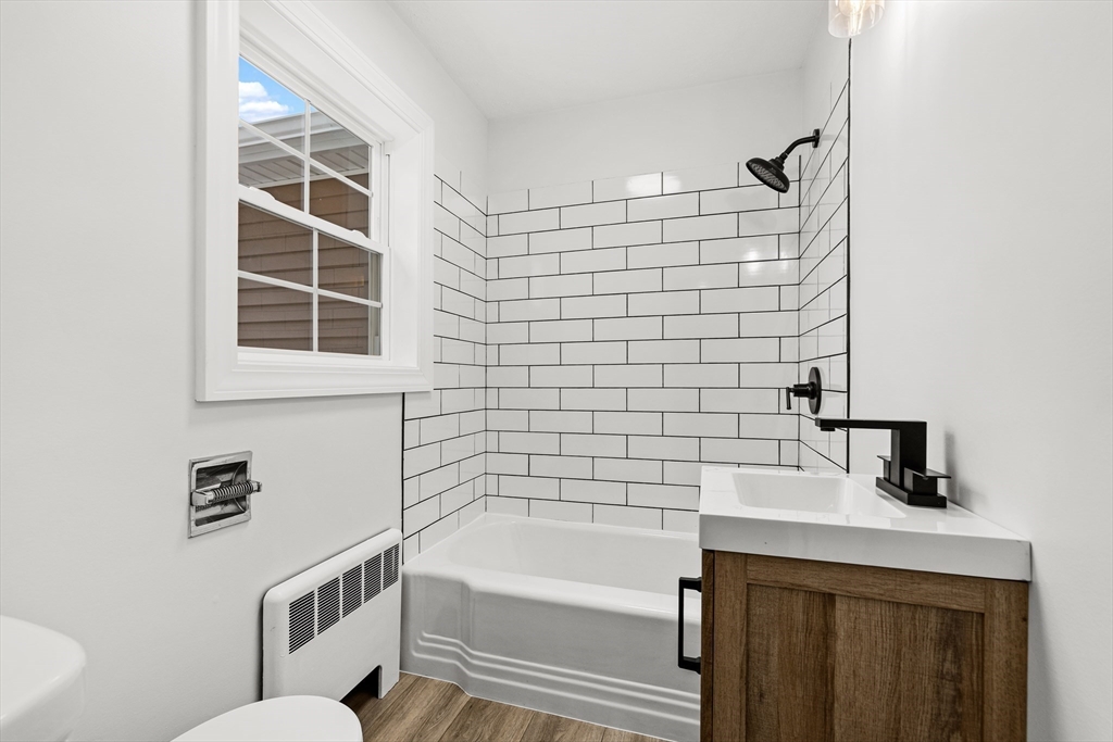 225 Rich Street Fall River, MA 02720 - Photo 14 of 30 a bathroom with a toilet a sink and bathtub