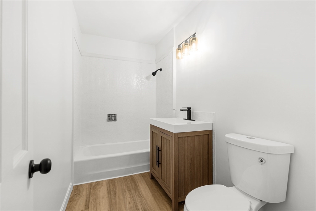 225 Rich Street Fall River, MA 02720 - Photo 15 of 30 a bathroom with a sink a toilet and shower