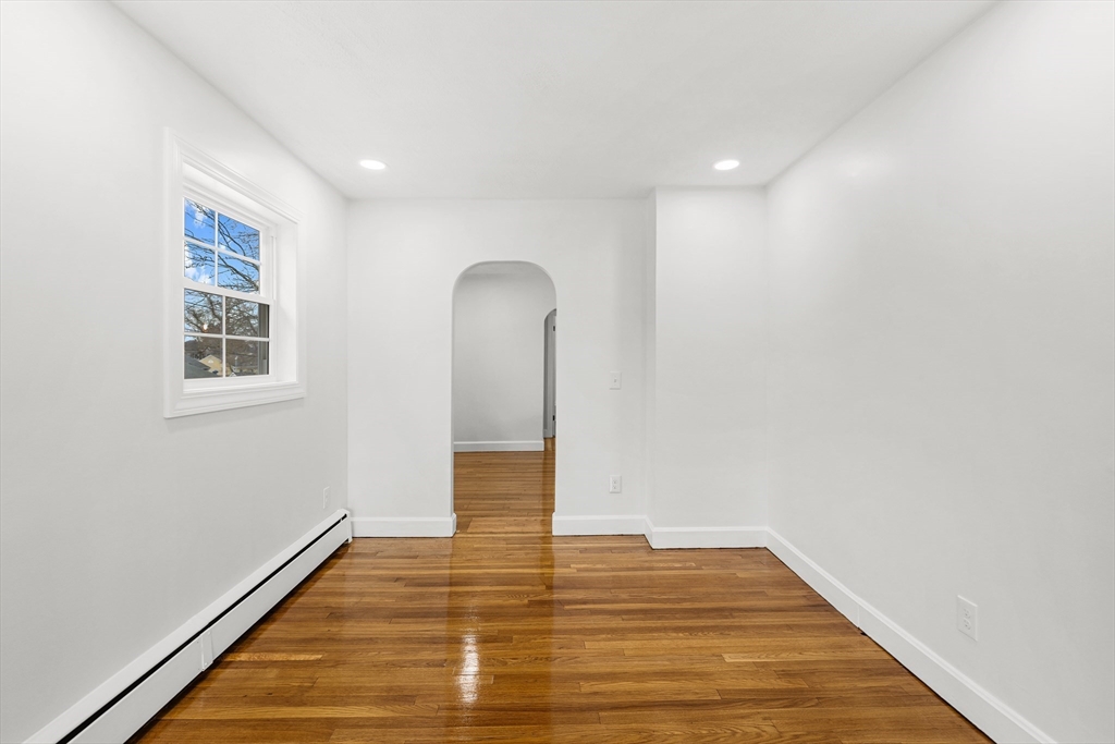 225 Rich Street Fall River, MA 02720 - Photo 16 of 30 a view of an empty room with wooden floor and a window