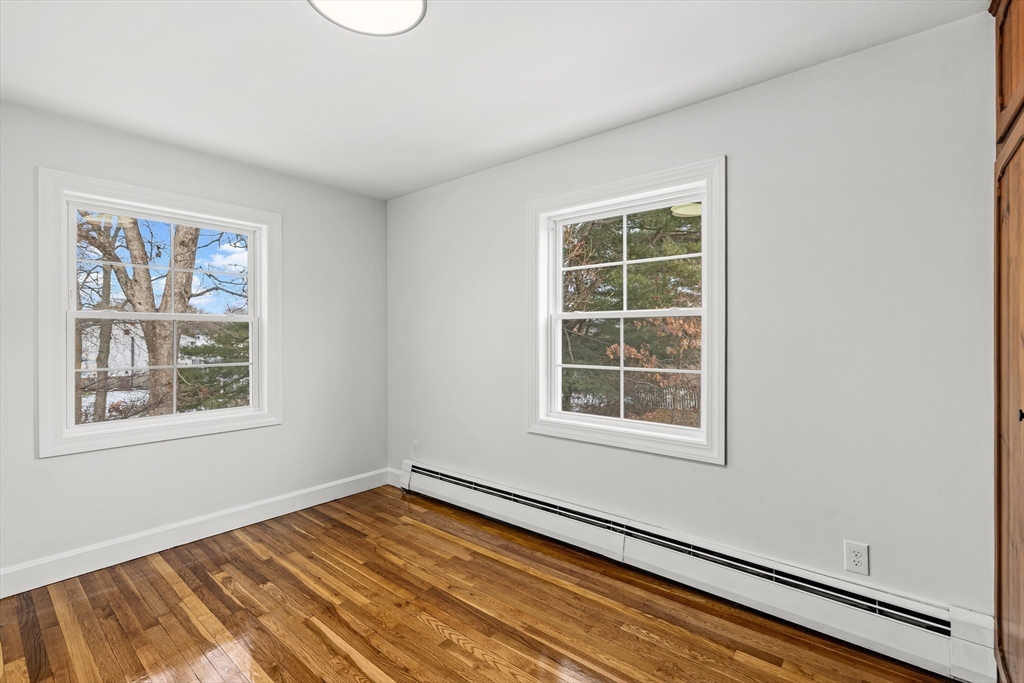 225 Rich Street Fall River, MA 02720 - Photo 24 of 30 an empty room with wooden floor and windows
