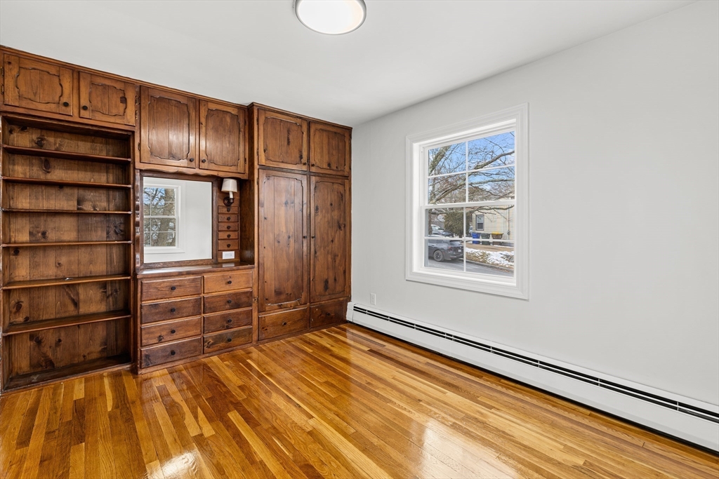 225 Rich Street Fall River, MA 02720 - Photo 25 of 30 a bedroom with a bed and cabinets