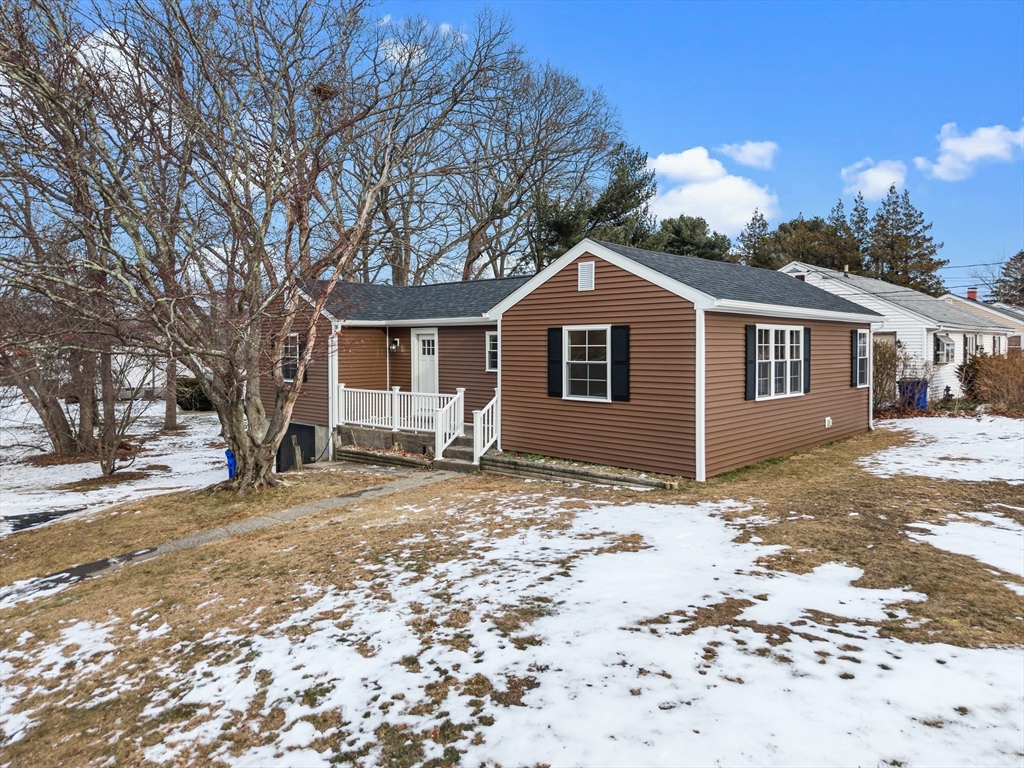 225 Rich Street Fall River, MA 02720 - Photo 3 of 30 a front view of a house with a dirt yard and a large tree