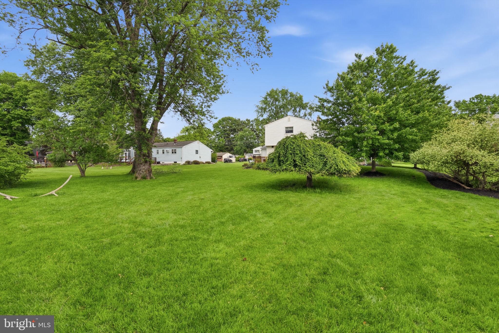81 Cherokee Road Doylestown, PA 18901 - Photo 32 of 43 a view of a garden with a house in the background