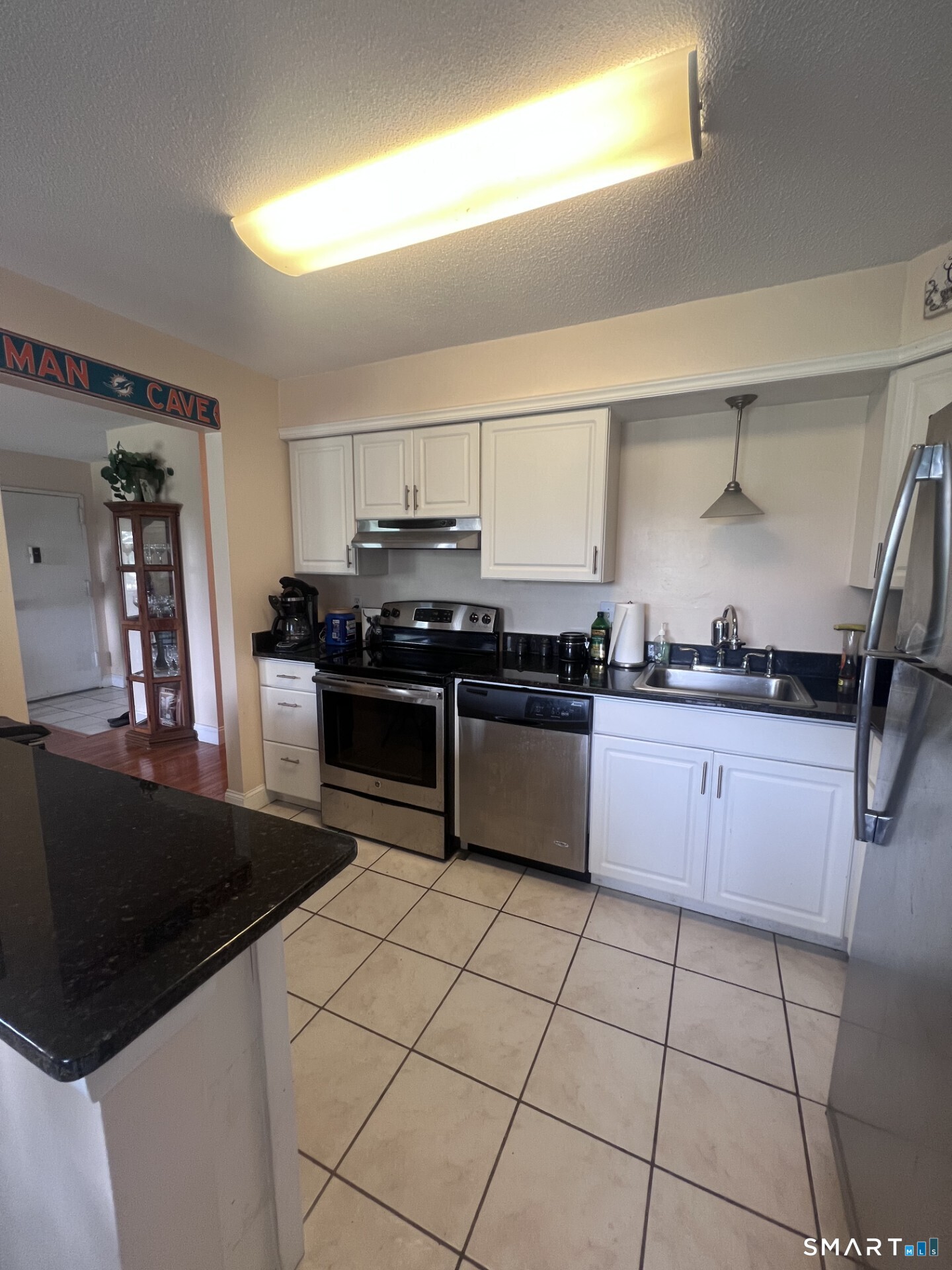 93 Kent Court, Unit 93 Meriden, CT 06450 - Photo 27 of 27 a kitchen with stainless steel appliances granite countertop a stove a sink and a refrigerator