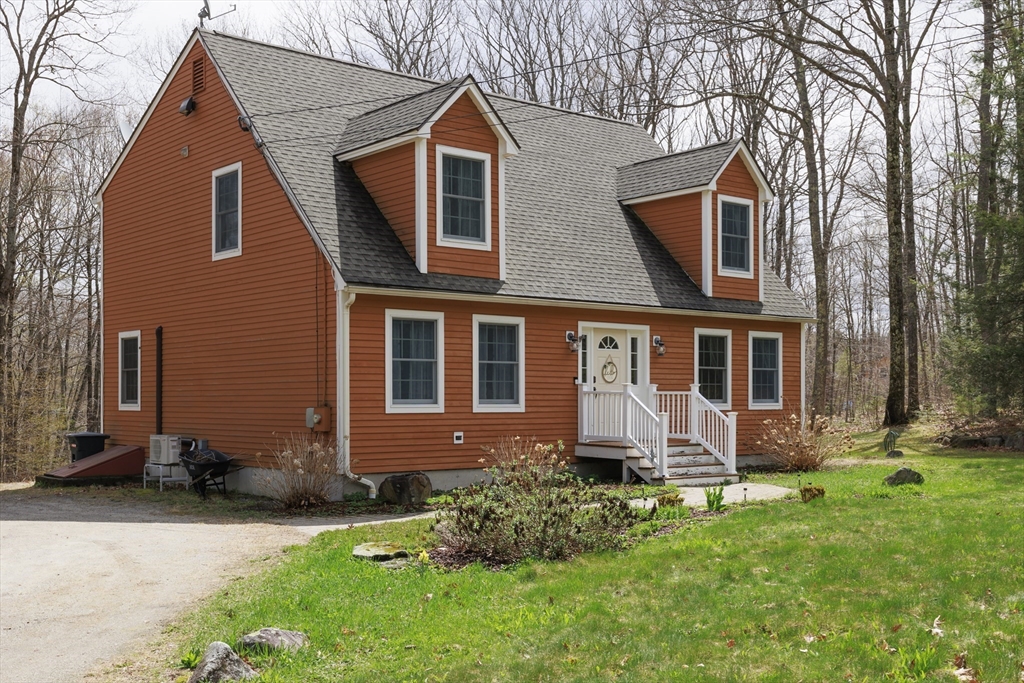 501 Reservoir Road Deering, NH 03244 - Photo 1 of 40 a front view of a house with a yard