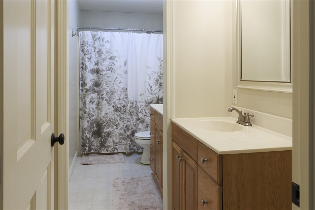 501 Reservoir Road Deering, NH 03244 - Photo 18 of 40 a bathroom with a sink and a mirror