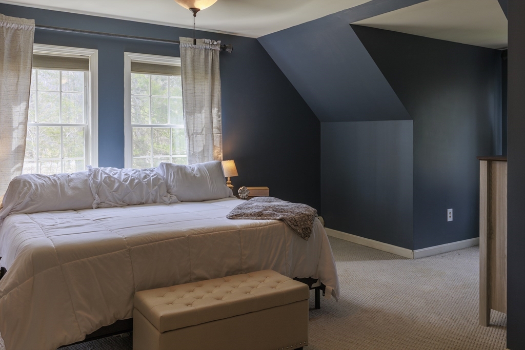 501 Reservoir Road Deering, NH 03244 - Photo 21 of 40 a bedroom with a bed and a window