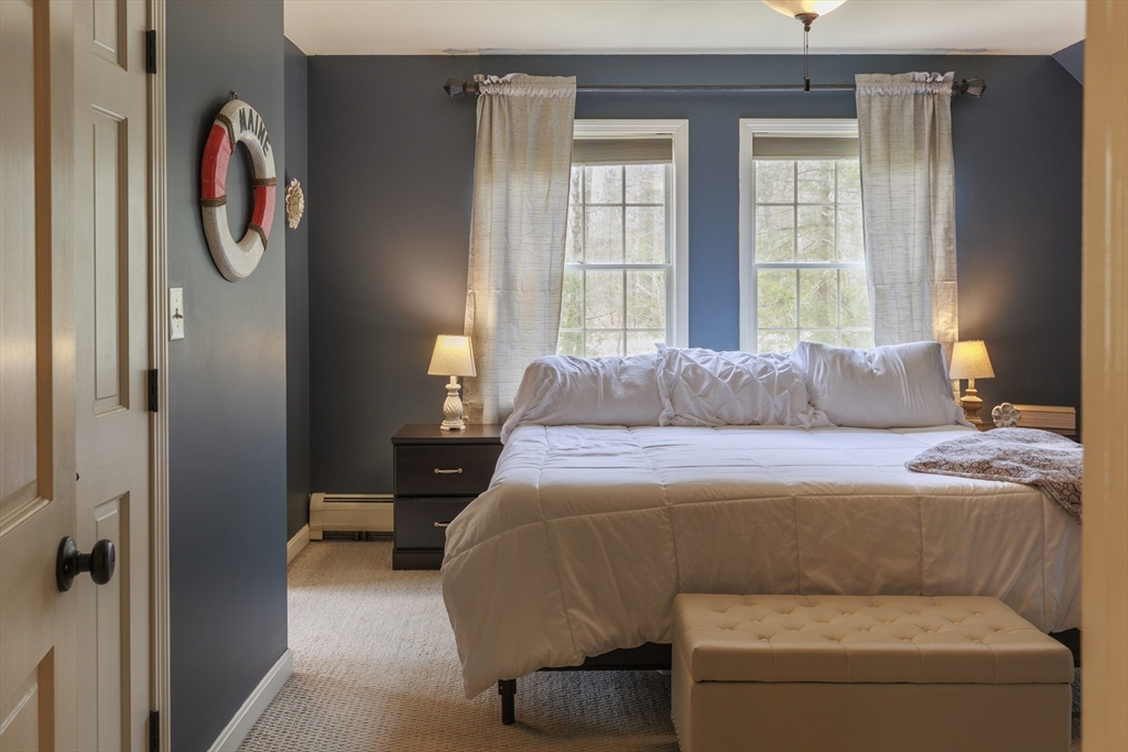 501 Reservoir Road Deering, NH 03244 - Photo 22 of 40 a bedroom with a bed and a window