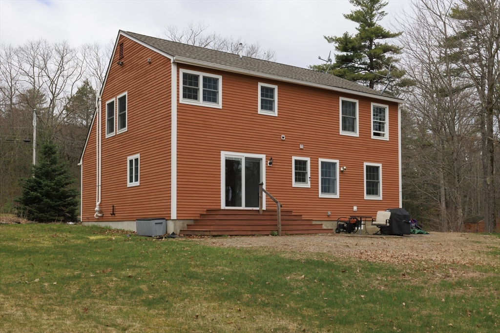 501 Reservoir Road Deering, NH 03244 - Photo 31 of 40 a front view of a house with a yard