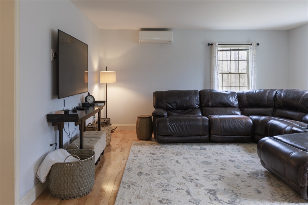 501 Reservoir Road Deering, NH 03244 - Photo 4 of 40 a living room with furniture and a flat screen tv