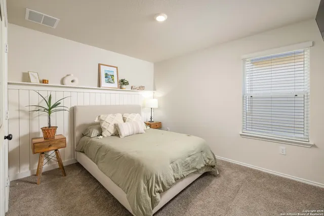 a bedroom with a bed and a table