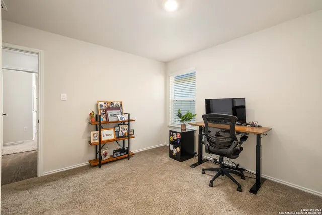 a view of a workspace with furniture