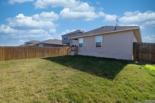 a brick house with a yard
