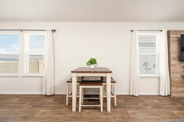 a view of a livingroom with furniture and a window