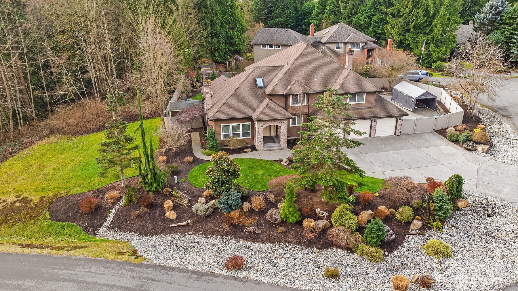 a aerial view of a house with a yard