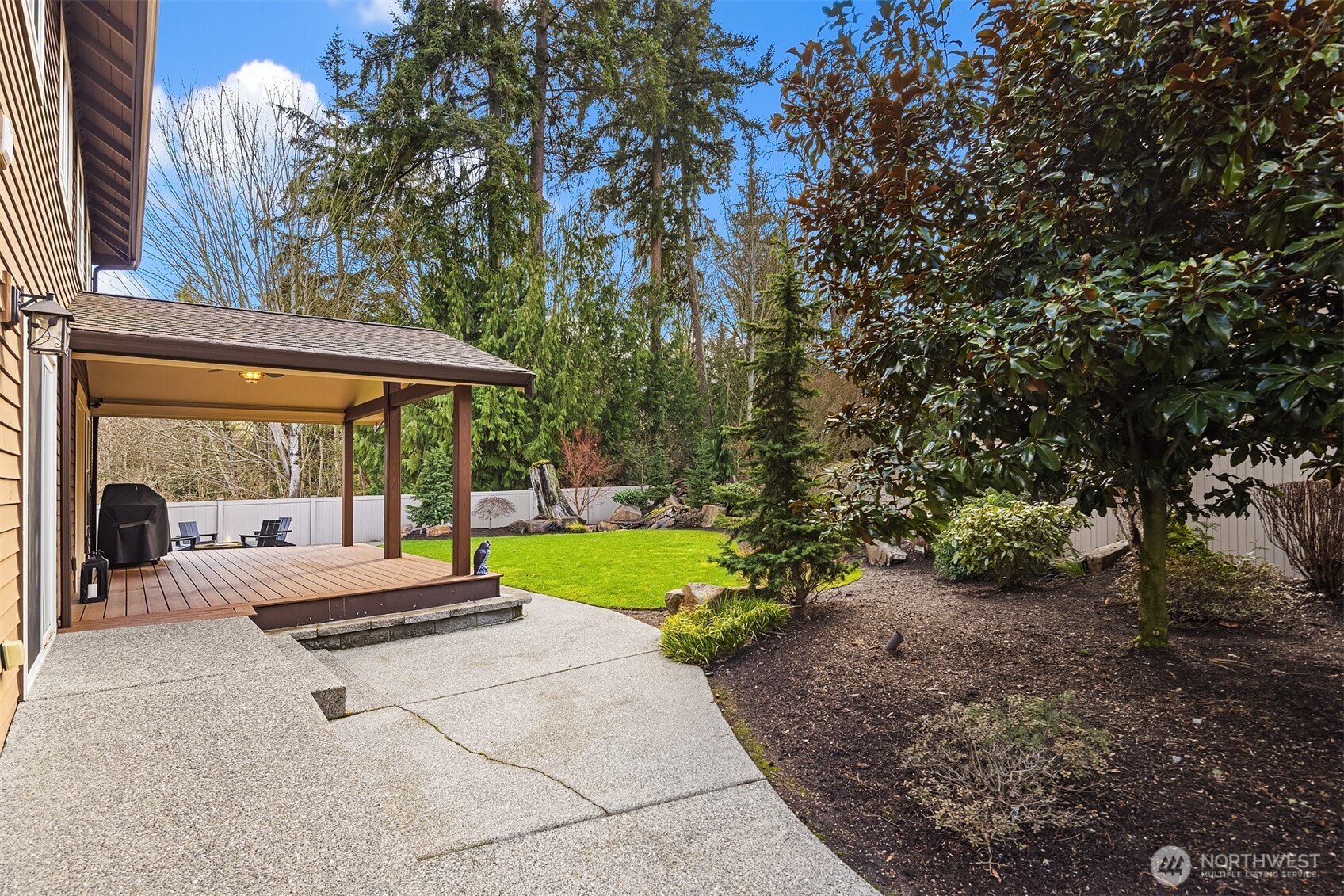 2730 187th Street Southeast Bothell, WA 98012 - Photo 32 of 38 a swimming pool with outdoor seating and yard