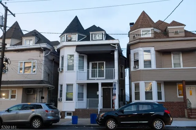 a view of a car parked in front of a building